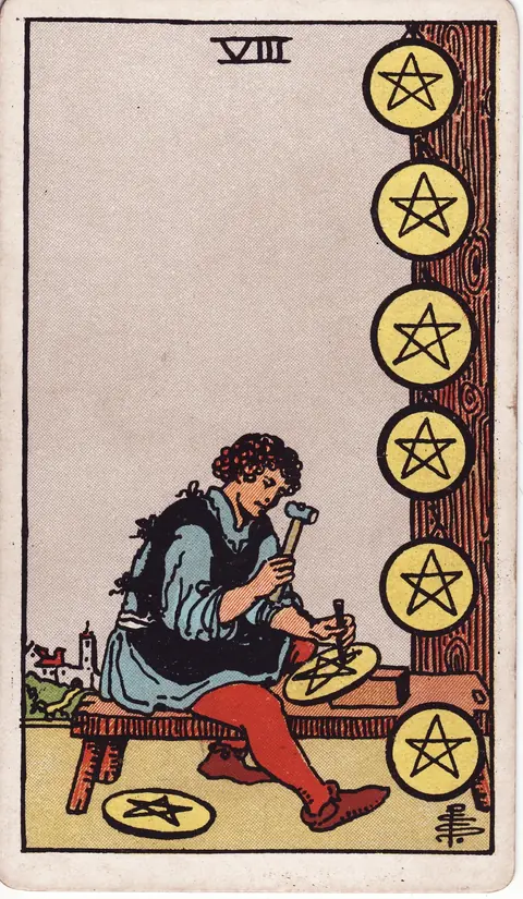 A craftsman engraving a pentacle at a bench with completed coins displayed on a wooden post