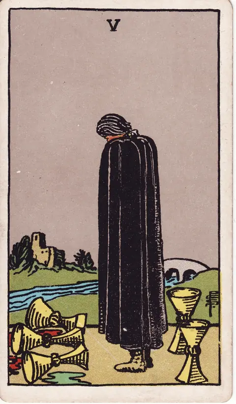A black-cloaked figure looks down at three spilled cups, with two upright cups behind him and a bridge crossing a river toward a distant building.