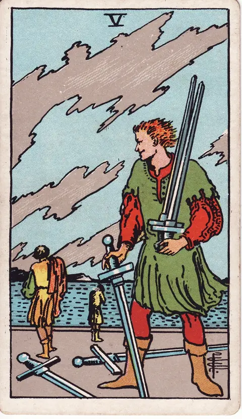 A man gathers swords as two defeated figures walk toward the water beneath a turbulent sky.