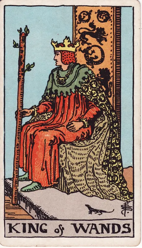 A crowned king holding a flowering wand on a throne decorated with lions and salamanders