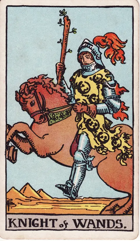 An armoured knight with red plumes riding a rearing reddish-brown horse and carrying a wand