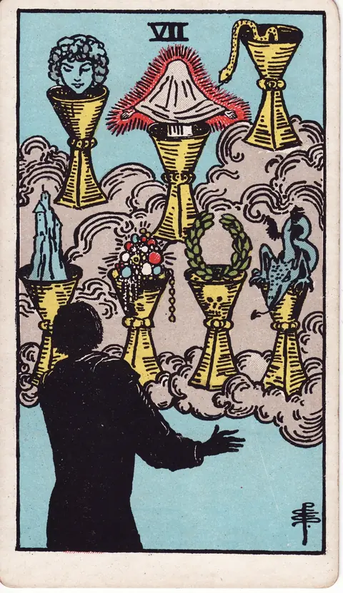 A shadowed figure faces seven cups floating in a cloud, holding a head, a shrouded figure, a snake, a castle, jewels, a laurel wreath and a dragon.