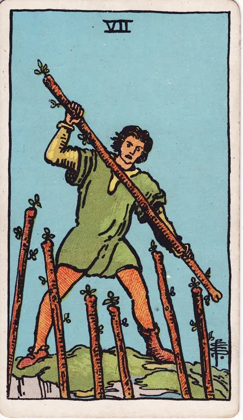 A man in mismatched footwear defending high ground with a wand against six raised staffs