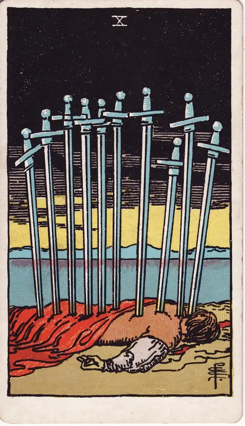 A man lies face down with ten swords in his back beneath a dark sky, while yellow light rises over calm water.