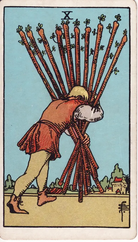 A man bent forward carrying a bundle of ten wands towards a nearby town