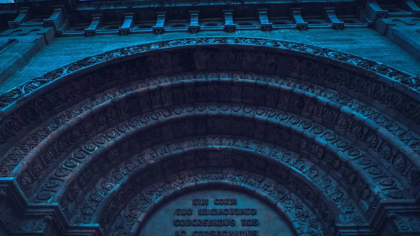 An ornately carved stone archway.